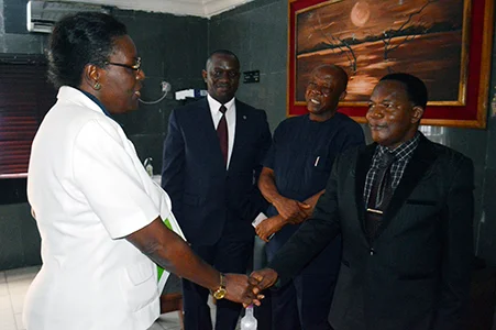 Dr-Gloria-UJOR-APRNet-EXCO-Member-and-NEST-EXECUTIVE-DIRECTOR-Presenting-Copies-of-NAPReJ-APRNet-Journal-to-FUTO-OWerri-VIce-Chancellor