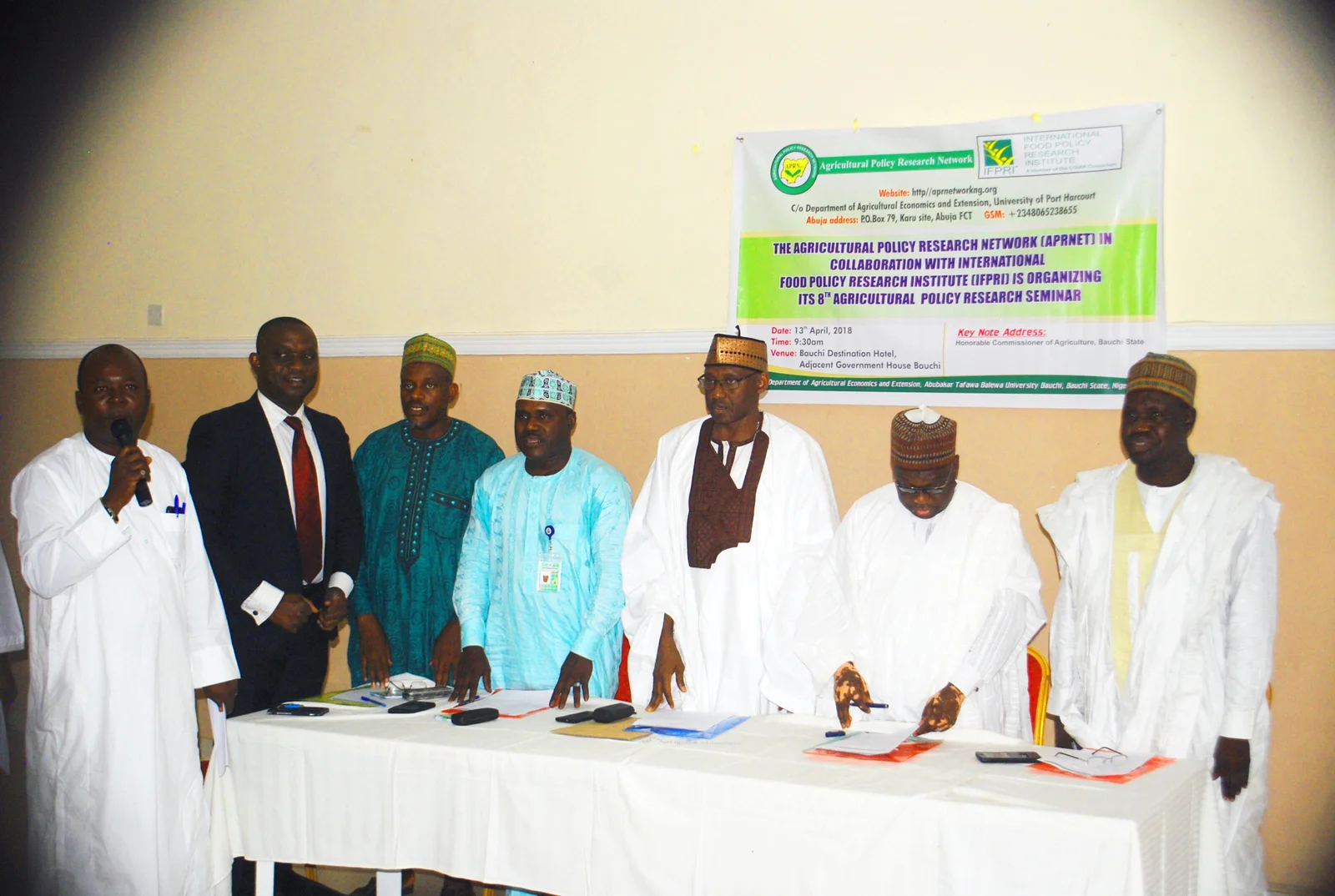 Members of the High Table singing the National Anthem before the opening address